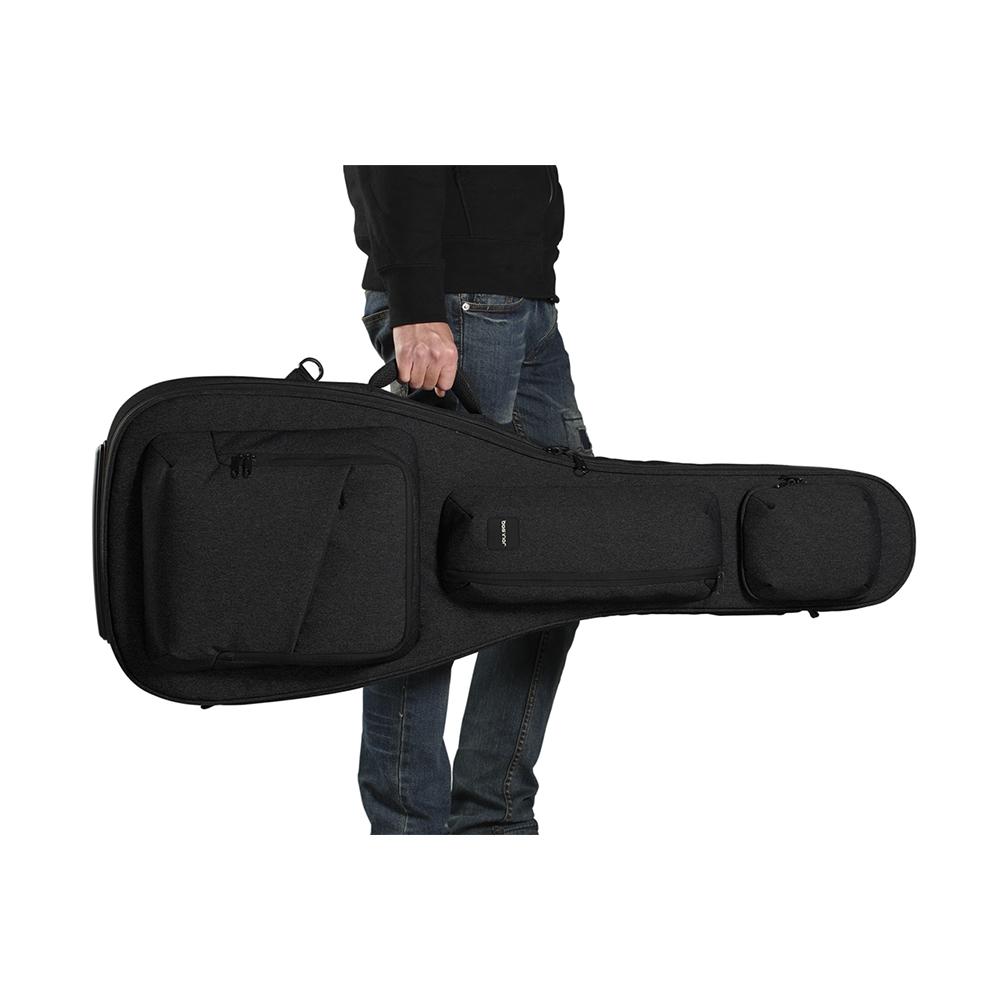 The man handles a black ACME acoustic guitar bag